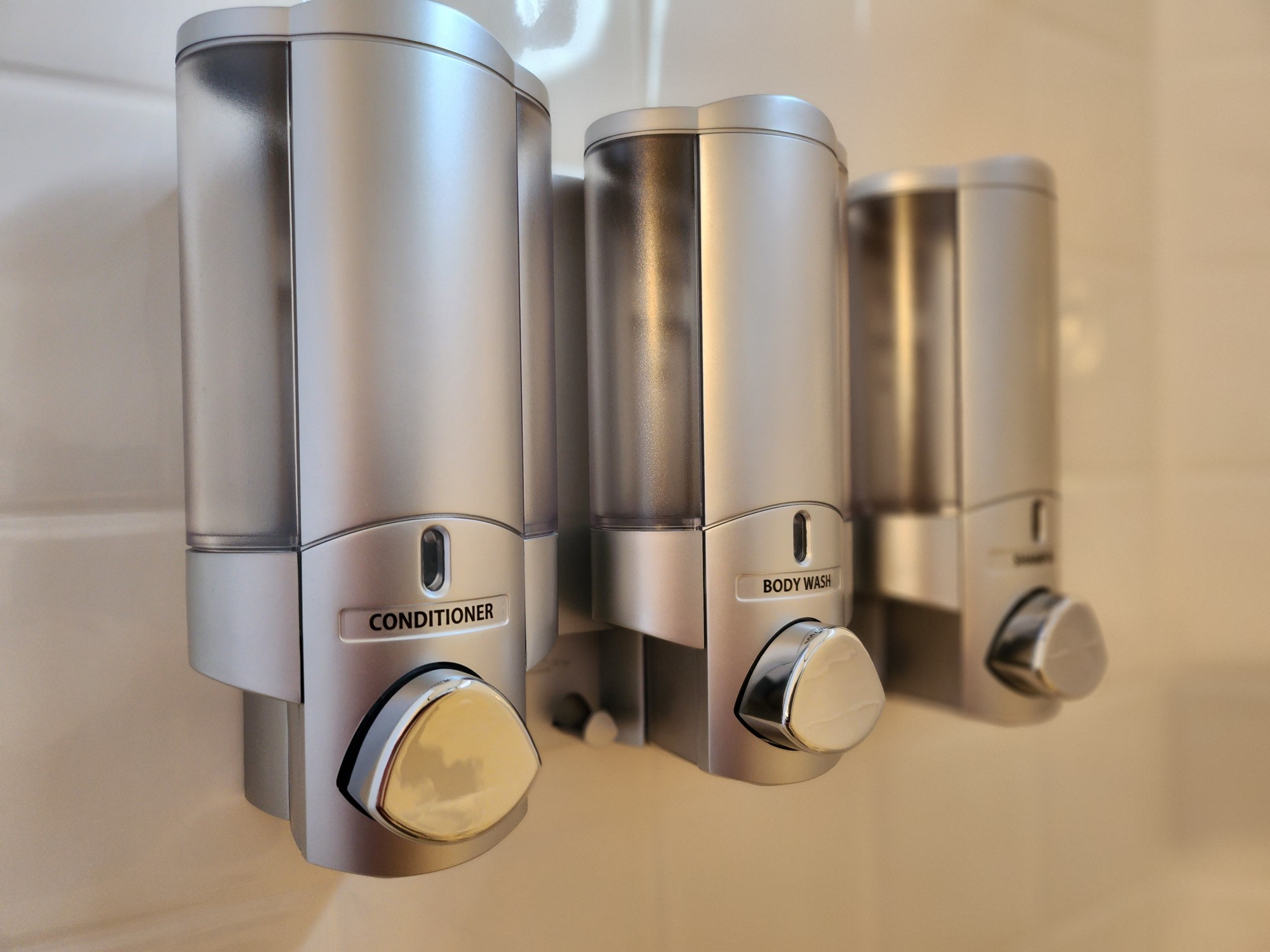 Wall-mounted shower dispensers