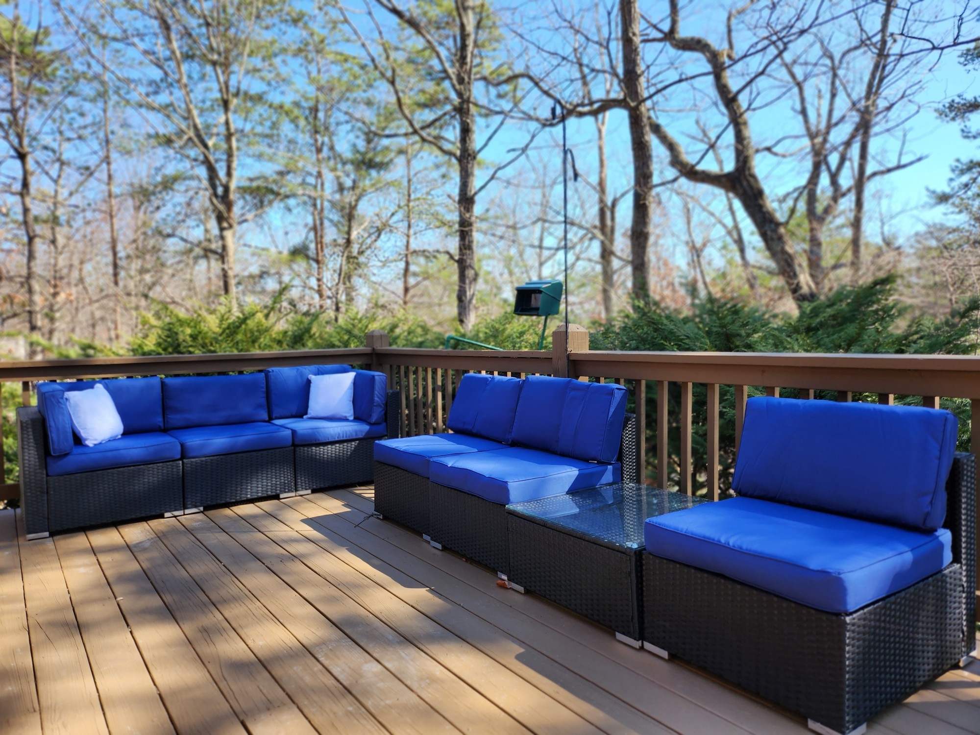 Blue cushioned outdoor lounge seating on the deck