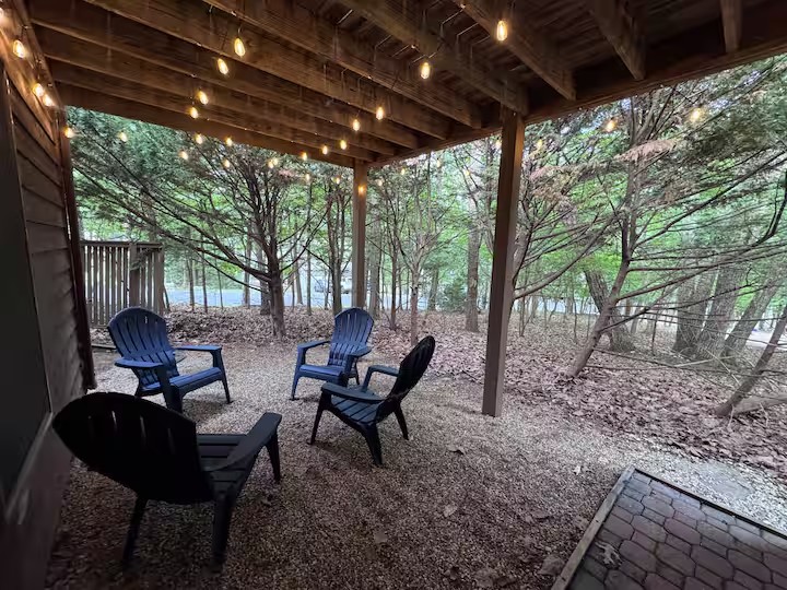Covered outdoor seating beneath string lights