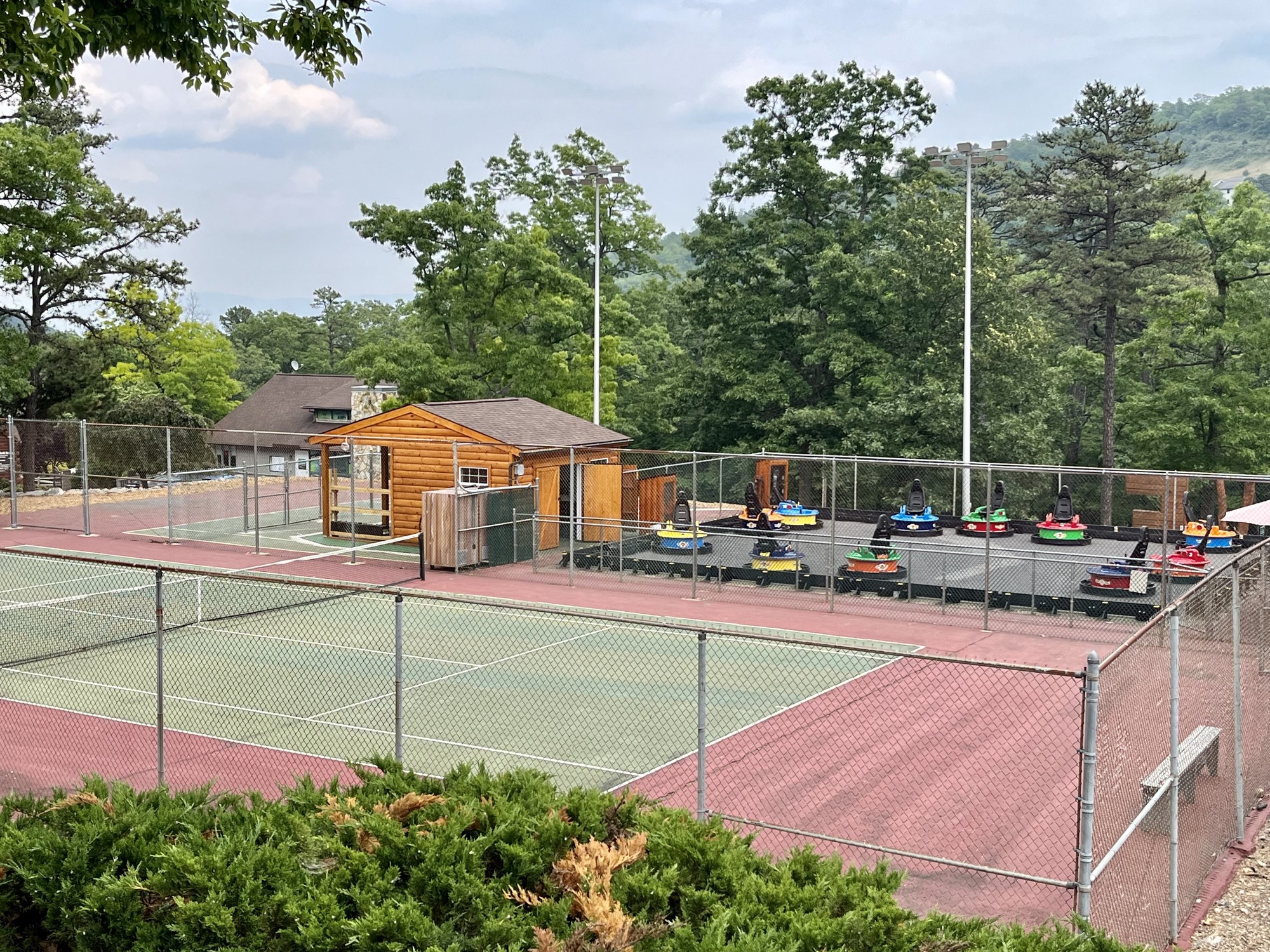 Nearby tennis courts and bumper-car area