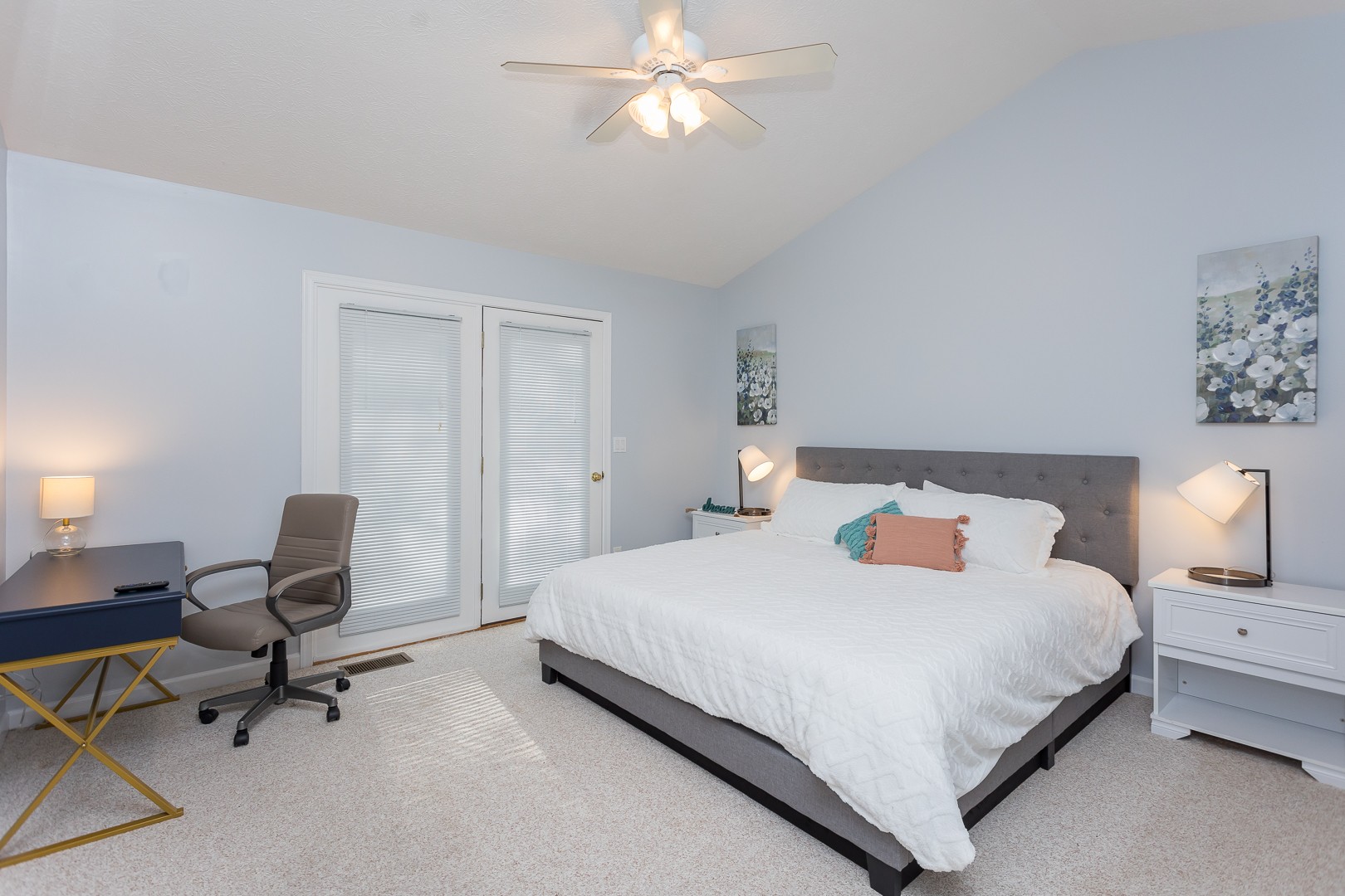 Main-floor king bedroom with desk and deck doors
