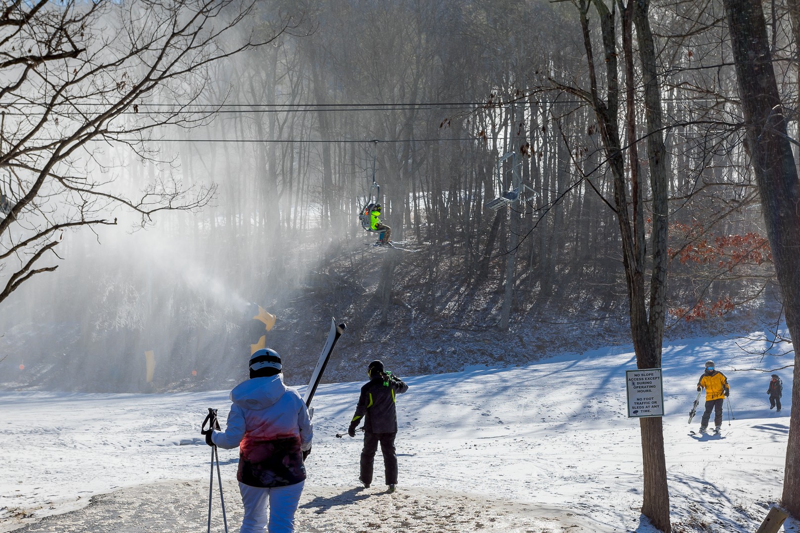 Skiers and a chairlift at the nearby ski area